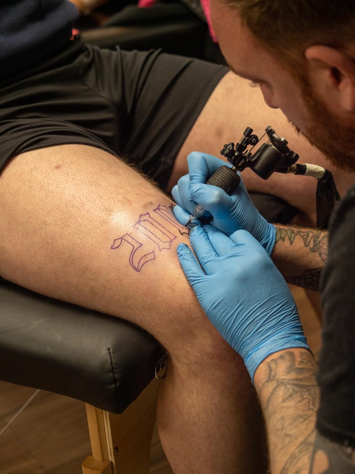 A S-Line Studios tattoo artist creating a custom tattoo